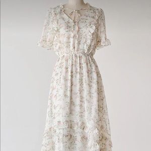 Sweet creamy and pink floral ruffle dress.